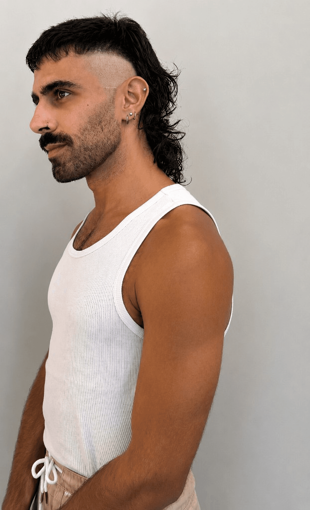 Profile of a modern mullet with skin fade